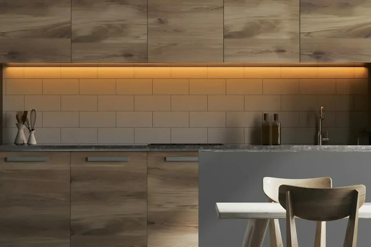 Under-cabinet LED strip lighting in modern kitchen with aluminium profile